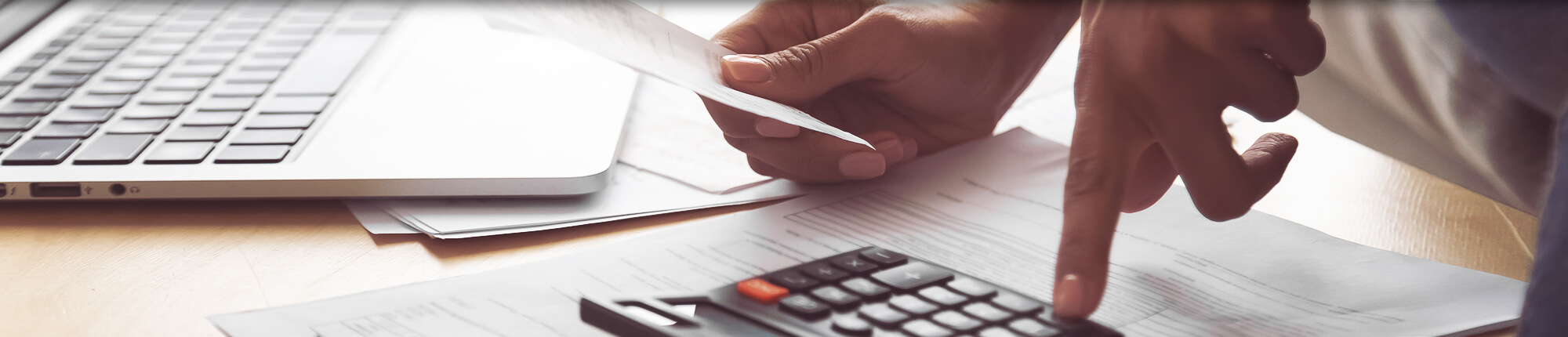 Woman Using Calculator